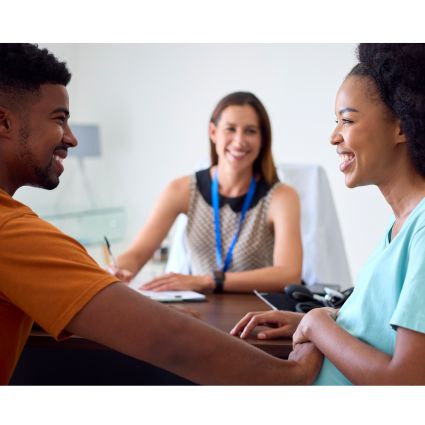 couple consulting a healthcare advisor